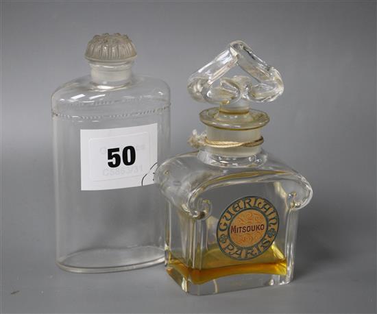 A Coty glass perfume bottle with frosted stopper, height 12cm, and a Guerlain Mitsouko perfume bottle, height 12cm